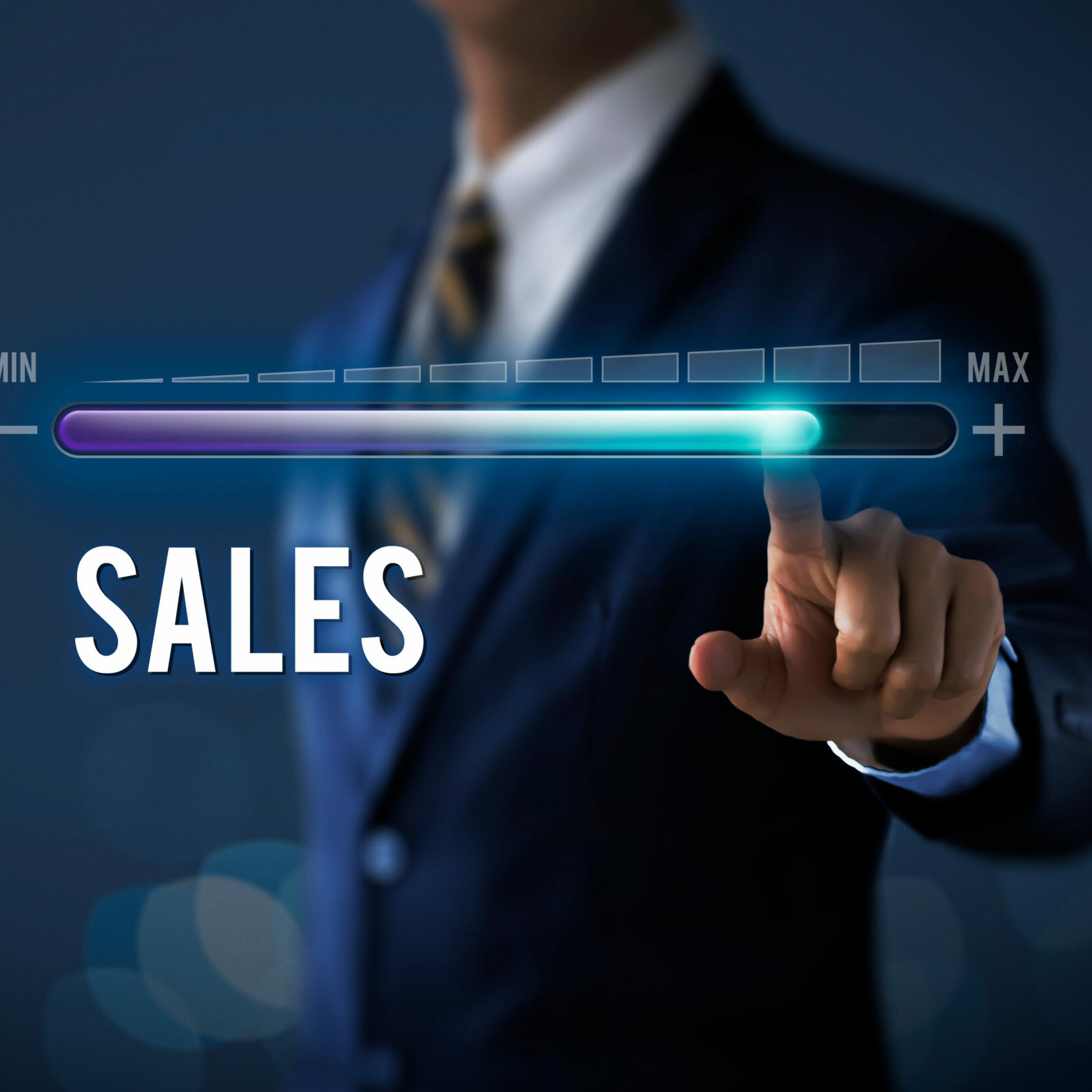 Sales growth, increase sales or business growth concept. Businessman is pulling up progress bar with the word SALES on dark tone background.